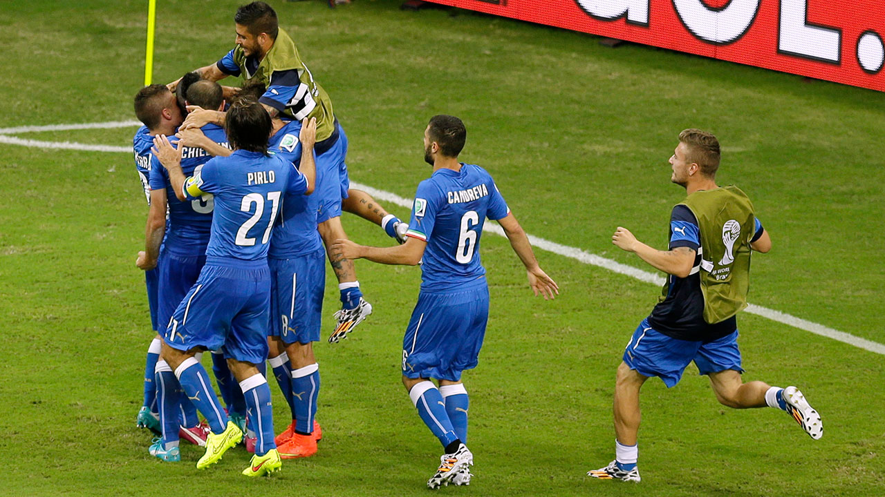 Italy players celebrate after Italy's Mario Balotelli scored his side's 2nd goal during the group D World Cup soccer match between England and Italy in Manaus, Brazil, Saturday, June 14, 2014. 