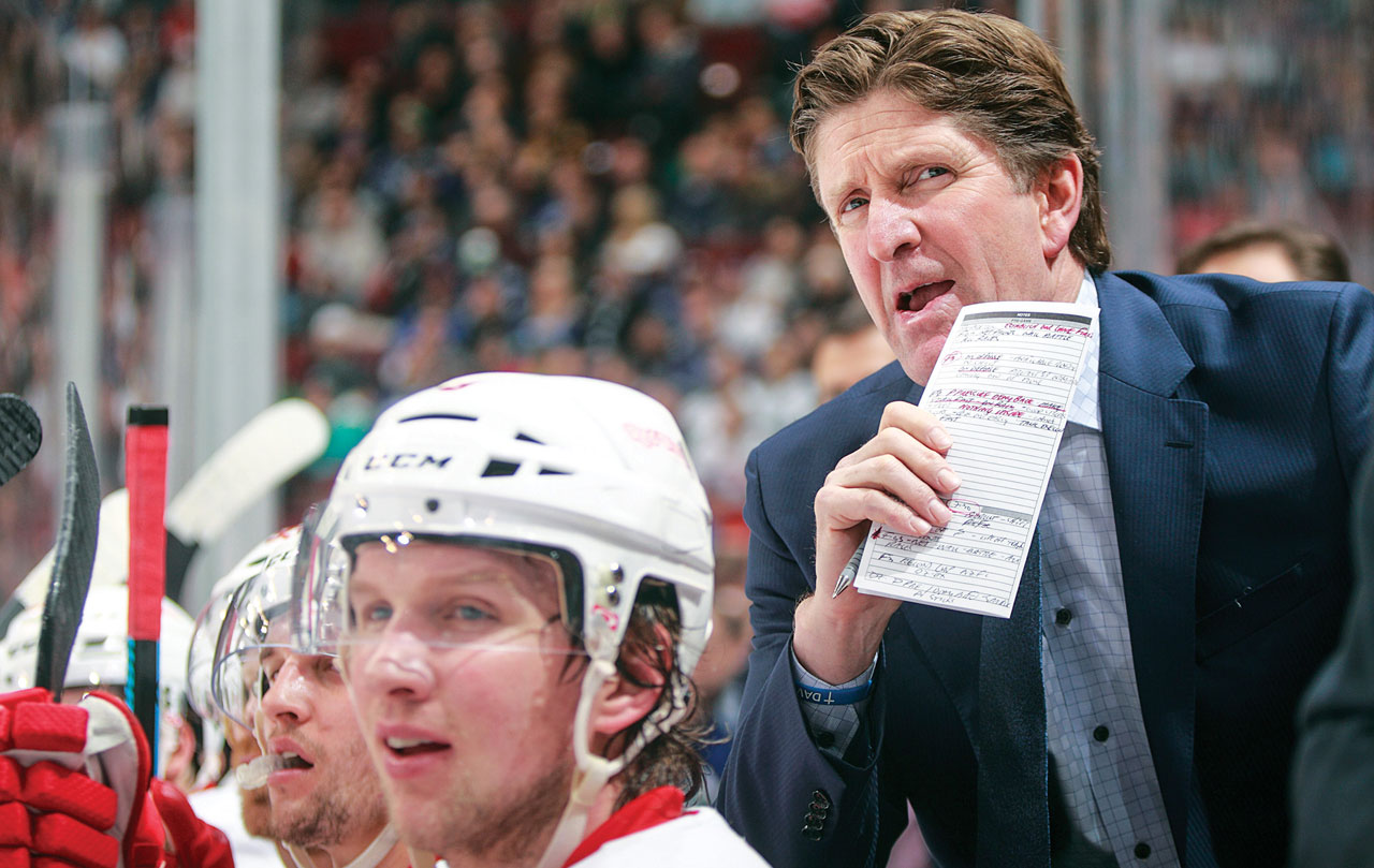 Anaheim Mighty Ducks coach Mike Babcock and players watch the