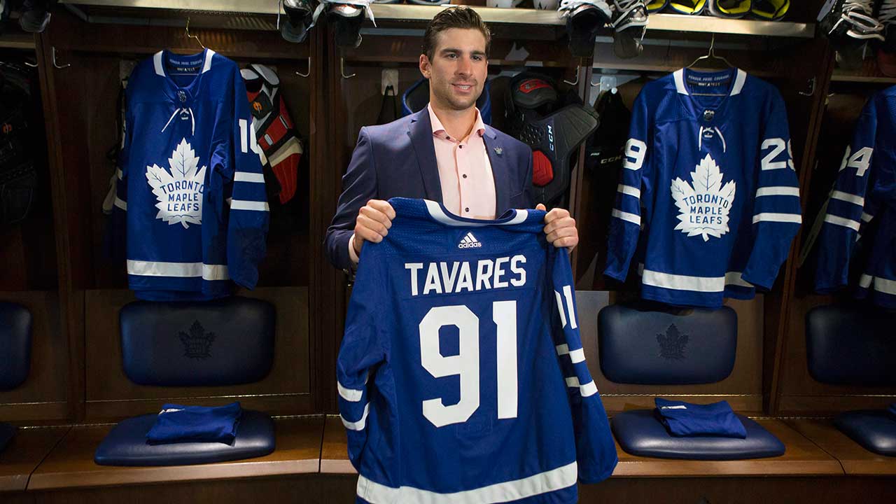 john-tavares-holds-up-maple-leafs-jerser.jpg